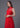 Qipology bridal - Sleeveless Wedding Qipao in classic red, featuring a mandarin collar in A-line silhouette; perfect for tea ceremony and evening banquet. (half body side view picture)